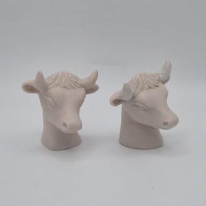 Lot of 2 Pale Pink Bisque Ceramic Bull Cow Head Figurines