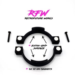 May include: A black 3D printed steering wheel adapter with four 10 mm magnets. The adapter is designed to fit Logitech G27, G29, G420, and G293 steering wheels. The adapter has a textured surface for extra grip.