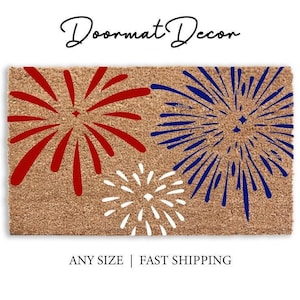 May include: A rectangular doormat with a brown background features a fireworks design in red, white, and blue. The text "Doormat Decor" is at the top. The words "ANY SIZE | FAST SHIPPING" are at the bottom.