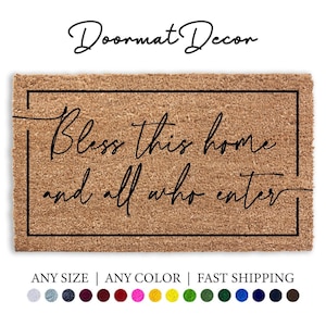 May include: A brown coir doormat with a black border and the text "Bless this home and all who enter" in a cursive font.