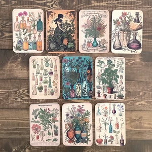 May include: Ten vintage style cards with botanical illustrations. Each card features a different floral arrangement with various colored flowers, leaves, and herbs. Some cards also include glass bottles and jars with colorful liquids.