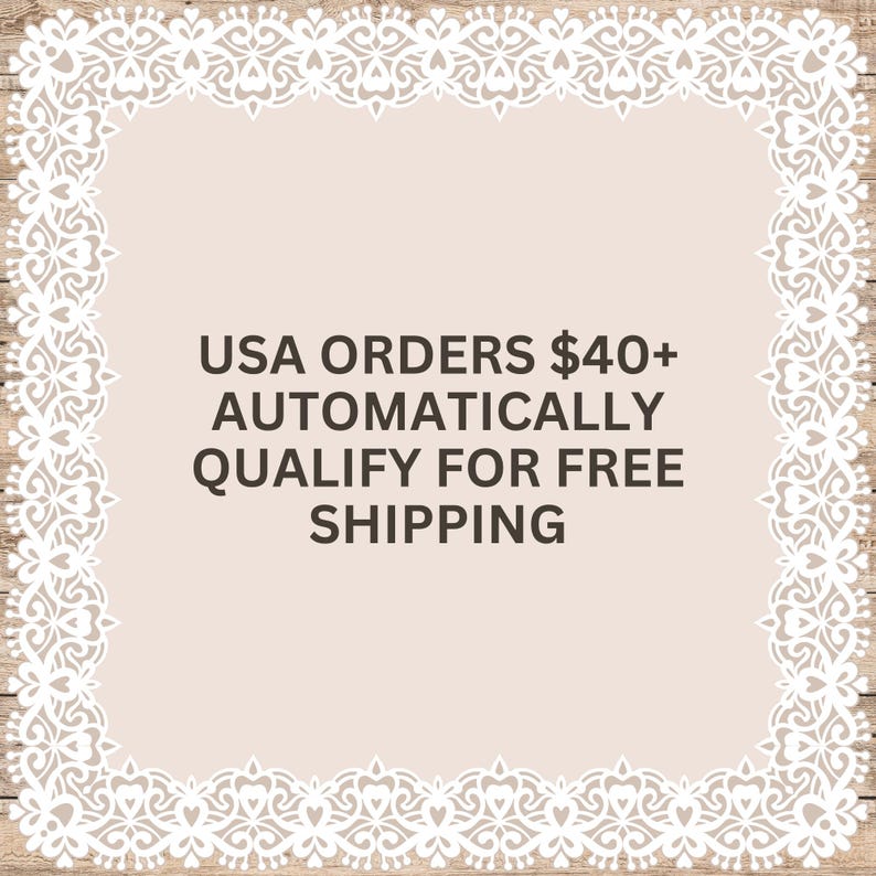 May include: A square graphic with a light beige center and a white intricate lace-style border. The text in the center reads: USA ORDERS $40+ AUTOMATICALLY QUALIFY FOR FREE SHIPPING. The design is set against a light wood grain background.