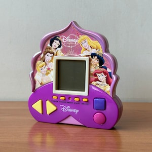 Vintage electronic handheld princess game by Zizzle, Y2K toys, Retro mini game console, Pocket LCD game