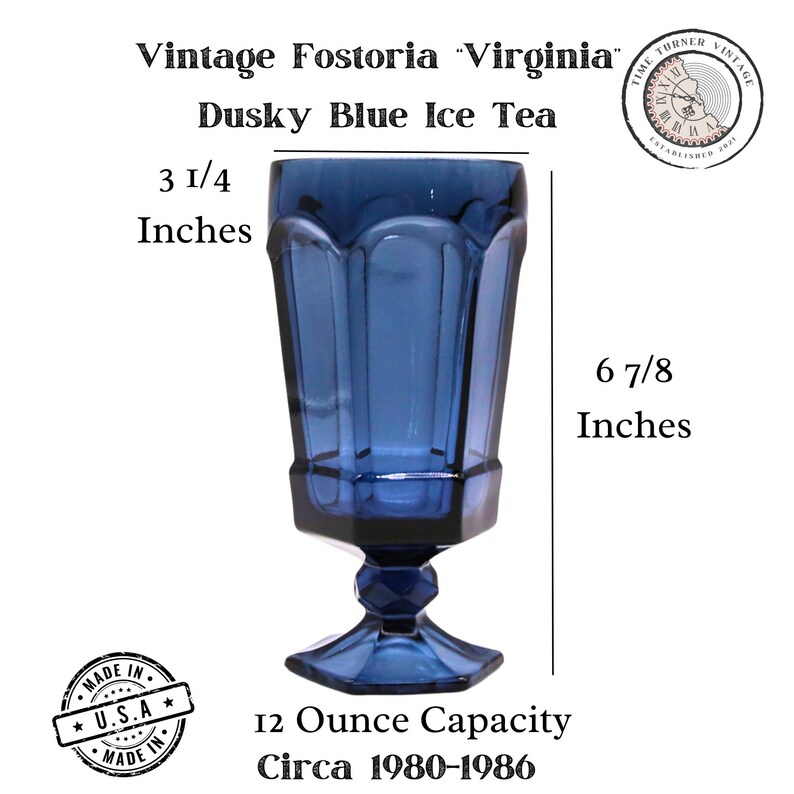 May include: A vintage Fostoria Virginia dusky blue glass ice tea goblet with a faceted stem and base. The glass measures 3 1/4 inches in diameter and 6 7/8 inches in height, with a 12 ounce capacity. Text includes Vintage Fostoria Virginia.
