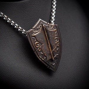 Monothic Battlescar Paladin Shield Necklace - Ornate Bronze