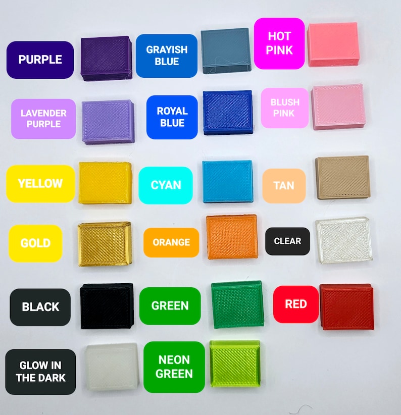 May include: A collection of 16 small plastic squares in various colors, including purple, blue, pink, yellow, cyan, tan, gold, orange, clear, black, green, red, and white. The squares are labeled with the color names, and some have additional text, such as "Glow in the Dark" and "Neon Green".