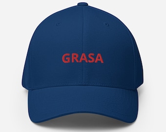 May include: A navy blue baseball cap with the word "GRASA" embroidered in red on the front.