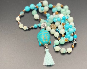 Pearl necklace, hand-knotted, turquoise, jade and tiger's eye pearls with howlite Buddha head pendant and silver flower of life