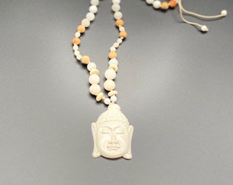 hand-knotted mala necklace made of sandalwood, jade and quartz beads, with hand-carved horn Buddha head, adjustable in length