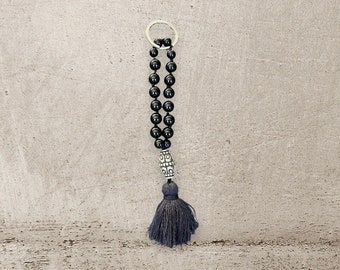 Key ring black onyx with oval ornamental bead and tassel