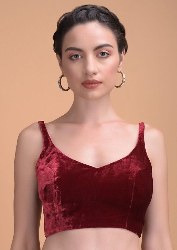 red sleeveless blouse in silk with leaf cut neckline