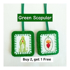 May include: Two green scapulars with matching green cords. One features an image of the Virgin Mary, the other shows the Immaculate Heart of Mary with the text "Immaculate Heart of Mary, pray for us now and at the hour of our death".