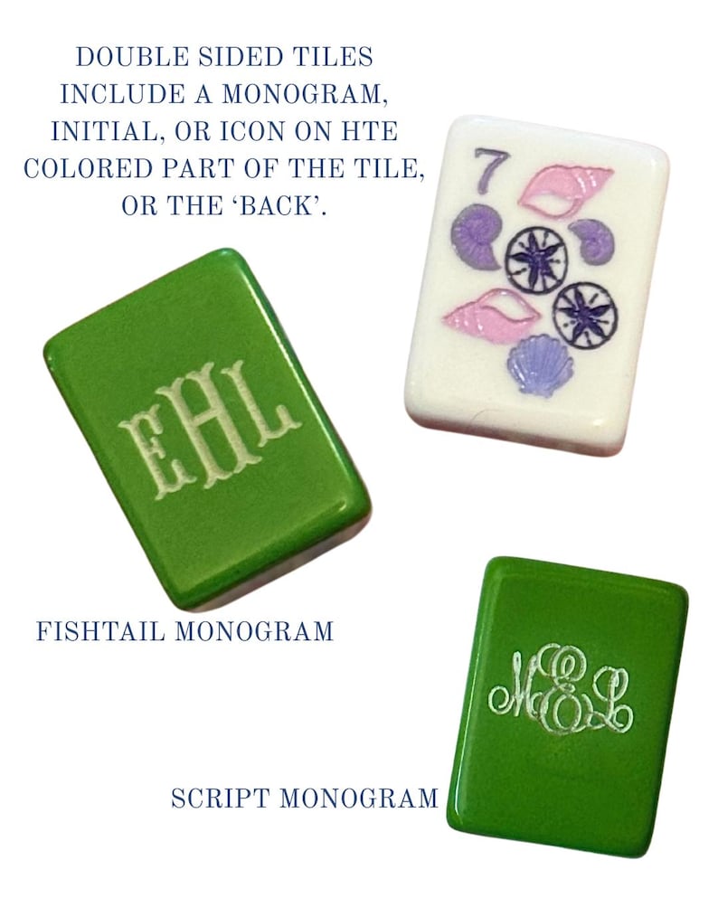 May include: Three double-sided tiles. Two green tiles with white monograms, one with a fishtail monogram and the other with a script monogram. The third tile is white with a number 7, seashells, and compass rose designs. Text: DOUBLE SIDED TILES INCLUDE A MONOGRAM, INITIAL, OR ICON ON THE COLORED PART OF THE TILE, OR THE 'BACK'.