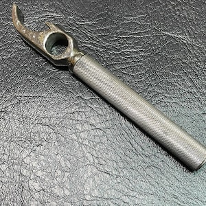 Silver and steel bottle opener