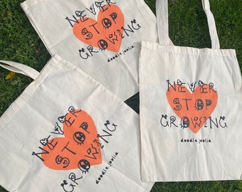 never stop growing screen printed tote bag