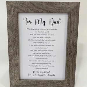 May include: A framed print with a poem about a father. The poem reads "For My Dad" and includes the text "What do you give to the guy who has given you the whole world, Who has been your hero and rock since you were a little girl?" and "Merry Christmas! Love your daughter. Amanda".