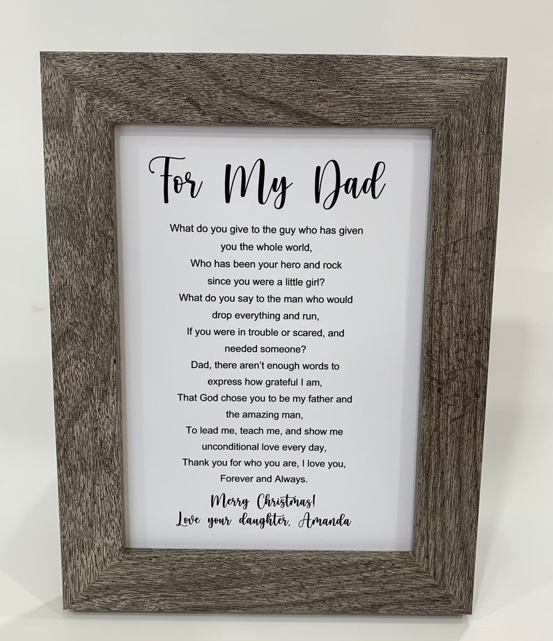 May include: A framed print with a poem about a father. The poem reads "For My Dad" and includes the text "What do you give to the guy who has given you the whole world, Who has been your hero and rock since you were a little girl?" and "Merry Christmas! Love your daughter. Amanda".