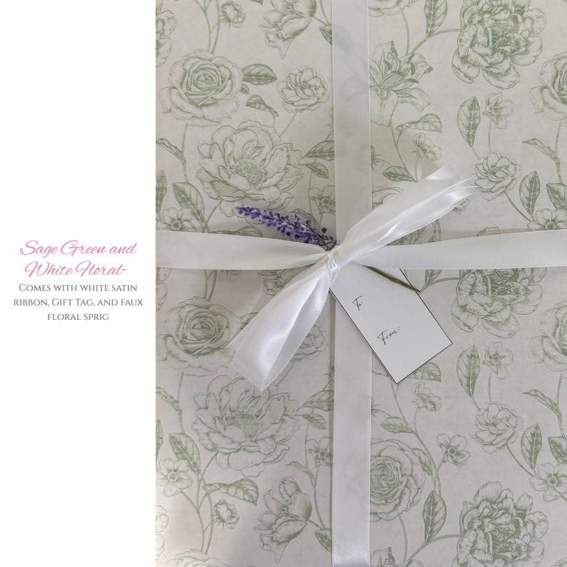 May include: A gift wrapped in sage green and white floral paper, tied with a white satin ribbon. A small tag is attached, and a faux floral sprig adds a decorative touch. The gift wrap features a repeating pattern of flowers.