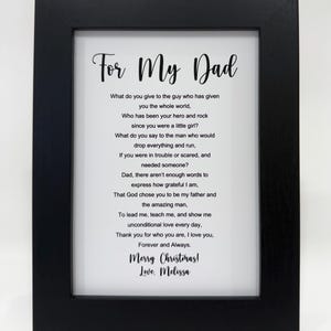 May include: A framed black and white print with a poem about a father. The poem reads "For My Dad" and includes the text "What do you give to the guy who has given you the whole world, Who has been your hero and rock since you were a little girl?" and "Merry Christmas! Love, Melissa".