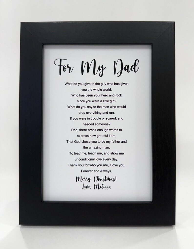 May include: A framed black and white print with a poem about a father. The poem reads "For My Dad" and includes the text "What do you give to the guy who has given you the whole world, Who has been your hero and rock since you were a little girl?" and "Merry Christmas! Love, Melissa".
