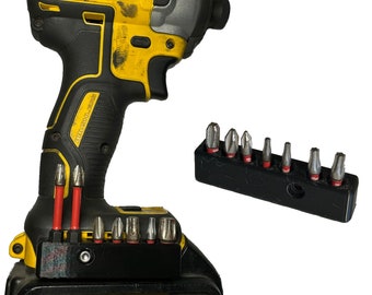 May include: A yellow and black DeWalt XR 18V 4.0Ah Li-Ion cordless drill with a black and silver impact driver and a black bit holder with a variety of bits.