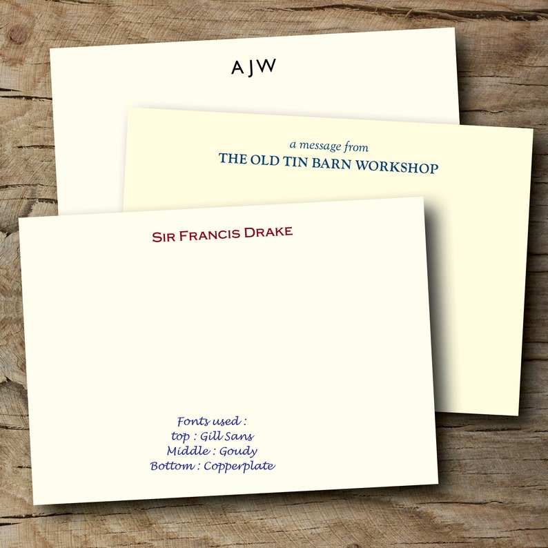 May include: A white card with the text "AJW" in black at the top, followed by "a message from THE OLD TIN BARN WORKSHOP" in blue. Below that is a second white card with the text "SIR FRANCIS DRAKE" in red. The bottom card also has the text "Fonts used: top: Gill Sans Middle: Goudy Bottom: Copperplate" in blue.
