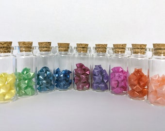 Origami lucky plastic rose stars in vials | Folding straw stars