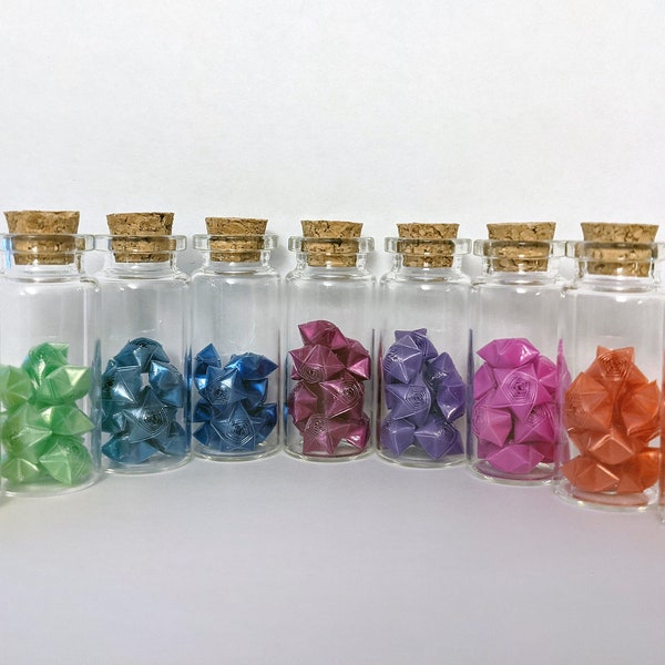 Origami lucky plastic rose stars in vials | Folding straw stars