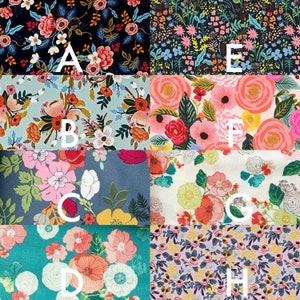 May include: A collage of eight fabric swatches labeled A through H, each featuring distinct floral patterns with varied color palettes including black, light blue, dark blue, white, teal, and pink backgrounds with assorted flower illustrations.