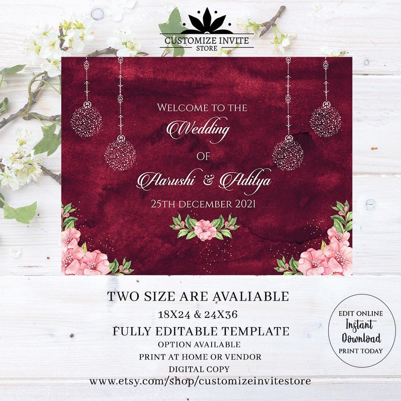 May include: A burgundy wedding invitation template with a floral design and silver glitter ornaments. The text reads "Welcome to the Wedding of Aarushi & Adilya 25th December 2021". The template is fully editable and available in two sizes: 18x24 and 24x36 inches.