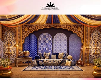 May include: A decorative event backdrop featuring a blue and white tiled pattern with gold arched frames. The scene includes a sofa with patterned cushions, a rug, a sitar, tabla drums, and two brass lamps with floral arrangements on each side.