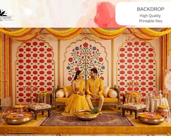 May include: A decorative event backdrop featuring a central arch with a floral tree motif flanked by two arched panels with repeating red flower patterns. The scene includes yellow marigold garlands, a wooden sofa, and brass bowls filled with flowers.