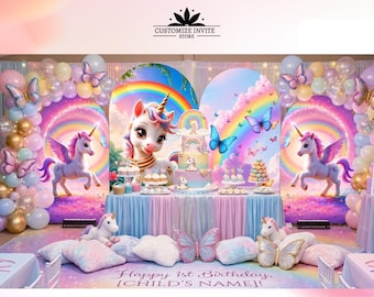 May include: A party backdrop set featuring a unicorn theme with rainbows, butterflies, and pastel balloons. The display includes a central table with a tiered cake, unicorn plush toys, and floor pillows. Text reads CUSTOMIZE INVITE STORE and Happy 1st Birthday [CHILD'S NAME].
