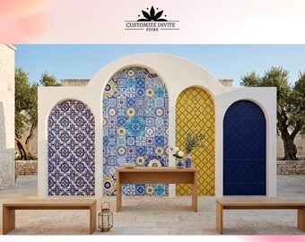 May include: A white arched backdrop featuring four distinct sections with blue and white floral tiles, a mix of blue and yellow patterned tiles, a yellow grid pattern, and a solid dark blue panel, with two wooden benches and a wooden table.