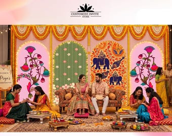 May include: A wedding stage backdrop featuring four arched panels decorated with floral motifs, elephant illustrations, and marigold garlands. A couple sits on a sofa in the center, surrounded by guests on floor cushions with small tables.
