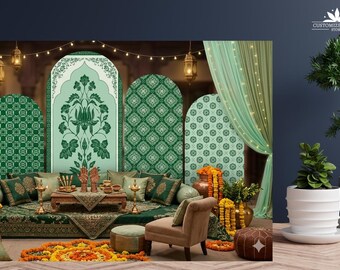 May include: A decorative event backdrop featuring four arched panels with green and white floral patterns, draped mint green curtains, string lights, and hanging lanterns. The scene includes a low wooden table, cushions, and marigold garlands.