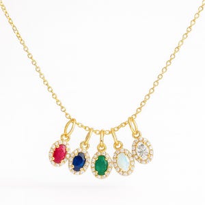 Wisiorek z prawdziwego złota próby 14k z prawdziwymi kamieniami szlachetnymi – naturalny diament, opal, szmaragd, akwamaryn i szafir