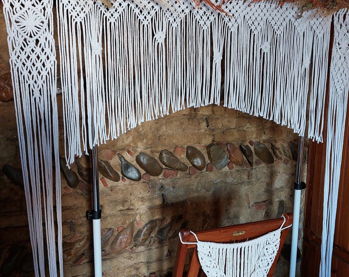 White cotton rope wedding arch