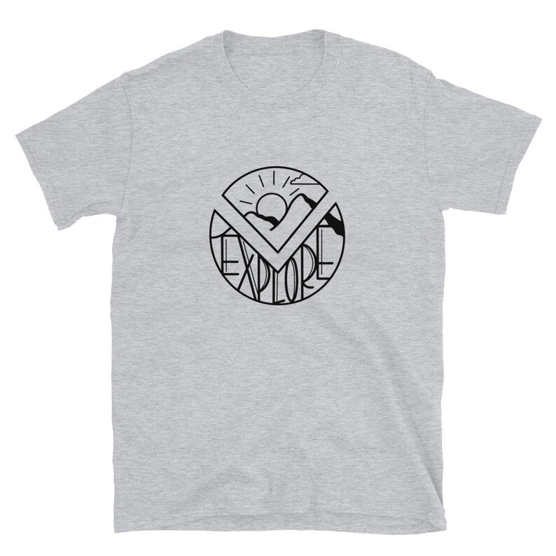 May include: A gray t-shirt with a black graphic of a sun, mountains, and the word "EXPLORE" in a circle.