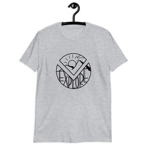 May include: A heather gray t-shirt with a black graphic of a sun, mountains, and the word "explore" in a circle.
