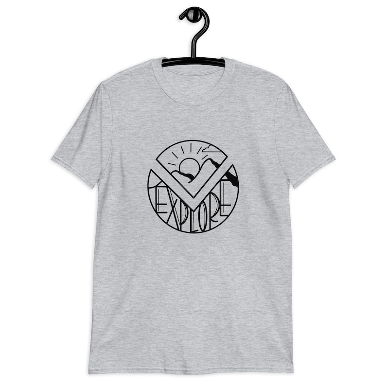 May include: A heather gray t-shirt with a black graphic of a sun, mountains, and the word "explore" in a circle.