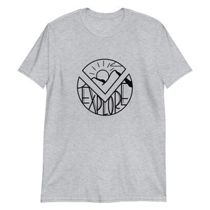 May include: A gray t-shirt with a black graphic design of a sun, mountains, and the word "EXPLORE" in a circle.