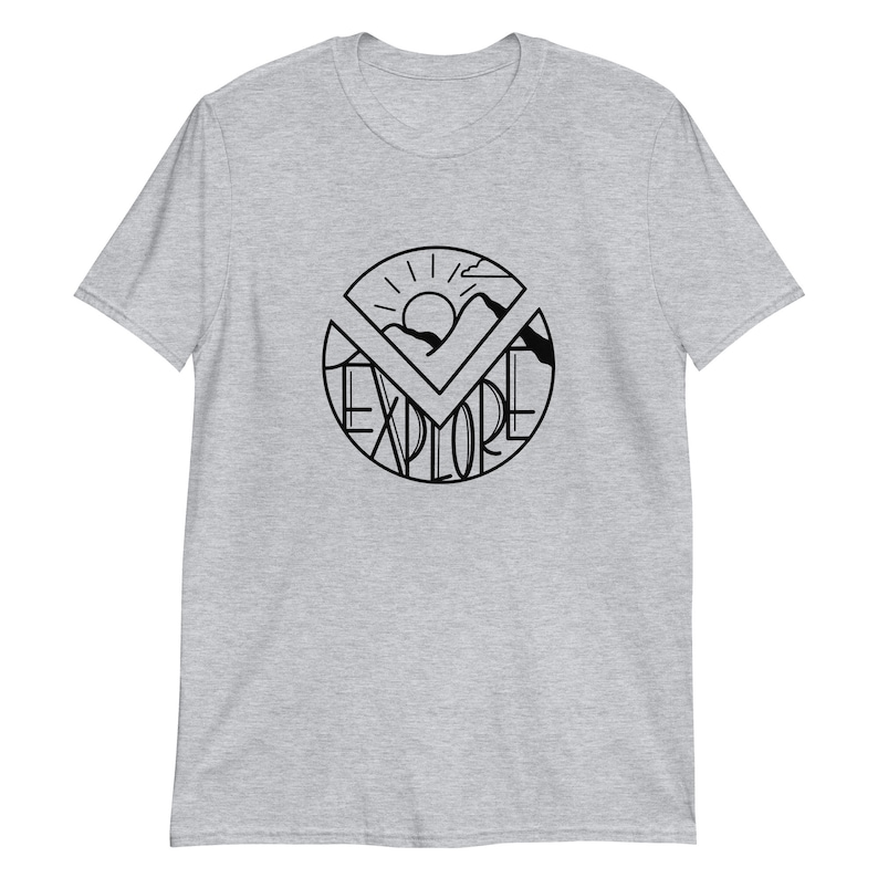 May include: A gray t-shirt with a black graphic design of a sun, mountains, and the word "EXPLORE" in a circle.