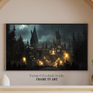 May include: A framed TV art print depicting a dark, gothic castle scene under a stormy sky. The artwork features a detailed illustration of a castle with illuminated windows and pathways, with the text "Twisted Bookish Souls FRAME TV ART".