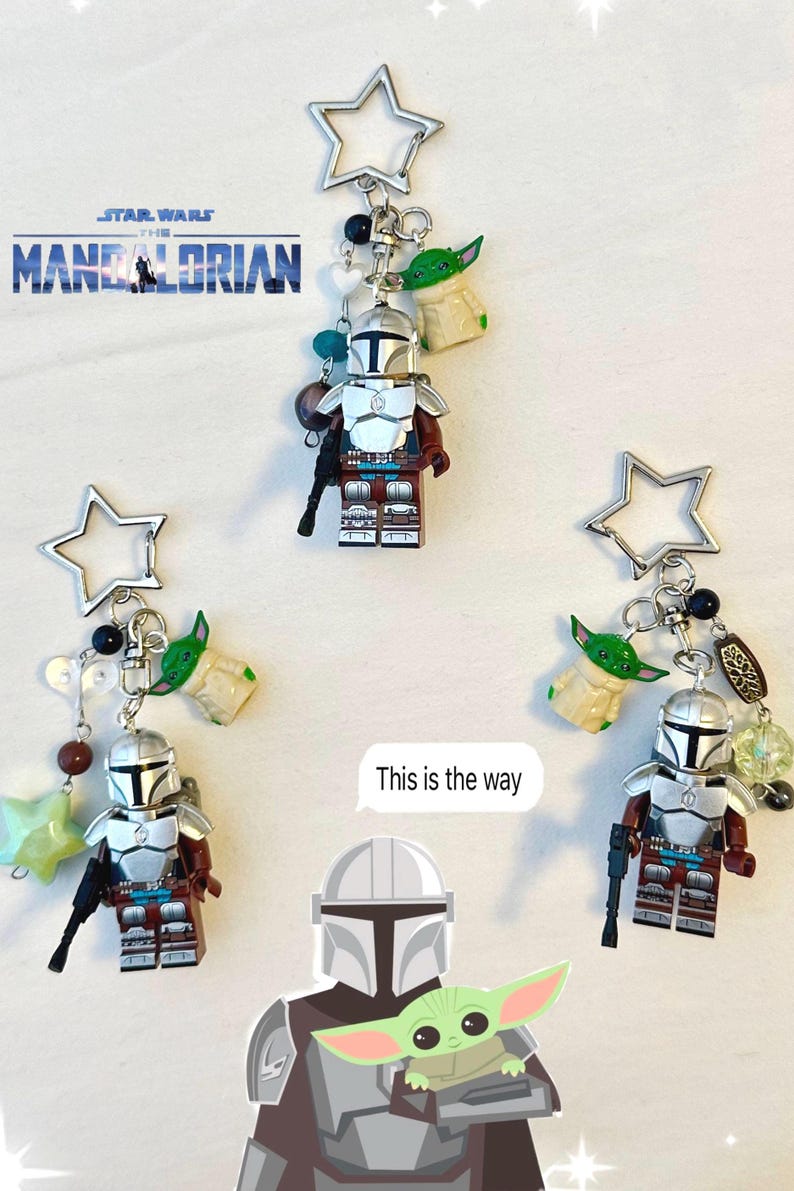 May include: Keychains featuring Mandalorian figures and Grogu charms. Each keychain includes a silver star-shaped charm, beads, and a miniature figure of the Mandalorian with a blaster. The text "This is the way" is also visible.