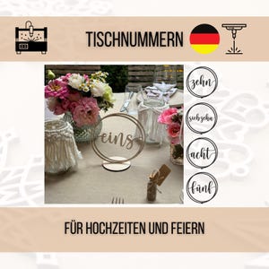 May include: A table setting with floral arrangements and wooden table number signs. The sign reads "eins" in a circle. Other signs with numbers are also visible. The text "FÜR HOCHZEITEN UND FEIERN" is at the bottom.