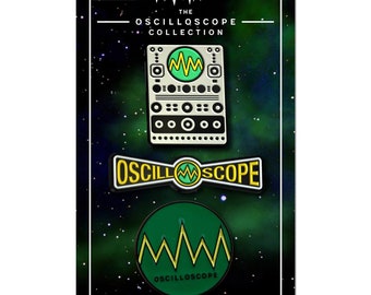 May include: Three enamel pins featuring a green and yellow oscilloscope design. The pins are on a black background with a white border and the text "The Oscilloscope Collection" and "@oscopelabs".
