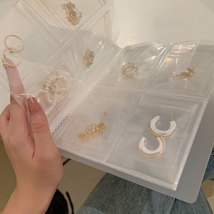 LWITHSZG Transparent Jewelry Storage Book with 50 Pcs Clear Small Plastic  Bags Ring Earring Organizer Book Card Holder Travel Pouch for Jewelry 