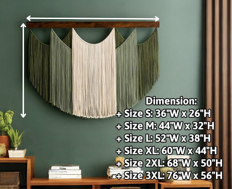 May include: A macrame wall hanging with a wooden bar. The design features a central cream-colored section flanked by olive green sections. Dimensions are provided, with the smallest size being 36"W x 26"H.