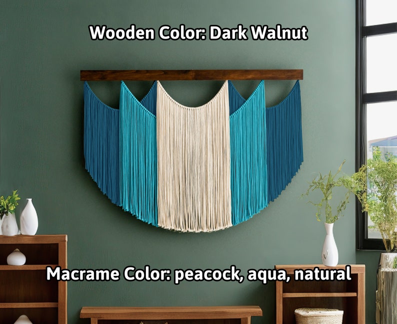 May include: A macrame wall hanging with a dark walnut wooden bar. The macrame features peacock, aqua, and natural colors. The text on the image says "Wooden Color: Dark Walnut" and "Macrame Color: peacock, aqua, natural".